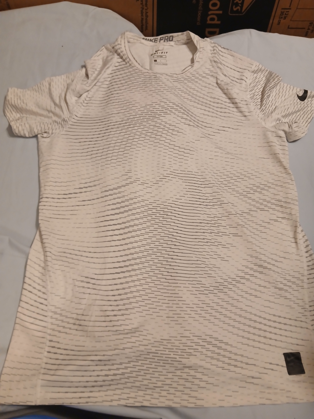 Nike White Short-Sleeve Performance Tee with Subtle Gray Stripe